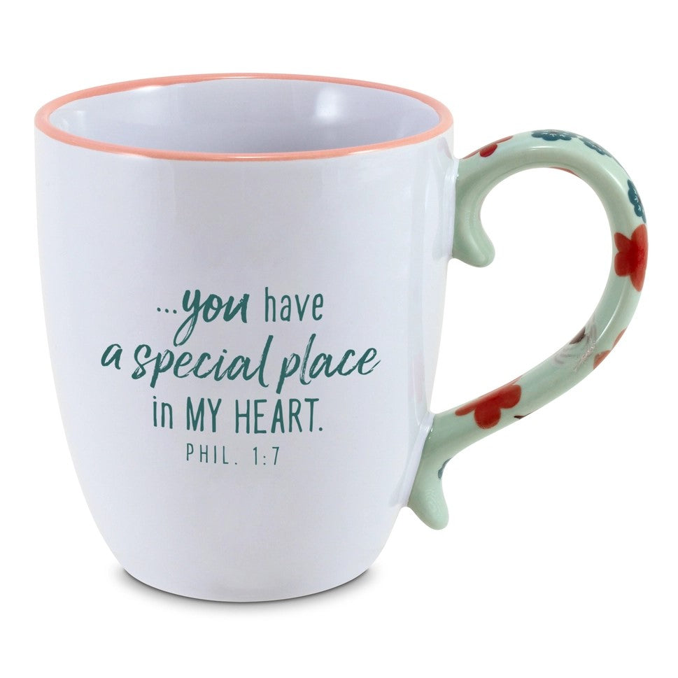 This is a beautiful coffee mug that says You're an Amazing Sister  and on the other side it says you have a special place in my heart. Phil. 1:7