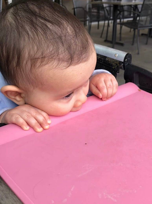 Protect your table and your child from bumping their head on the table with the beautiful ballerina pink table tyke mat. Grips to the table and helps keep drink and foods from sliding onto the child's lap. Great transition piece from highchair to table. 